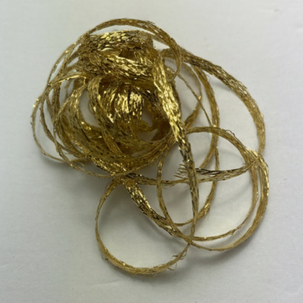 Gold Braid material on a white background