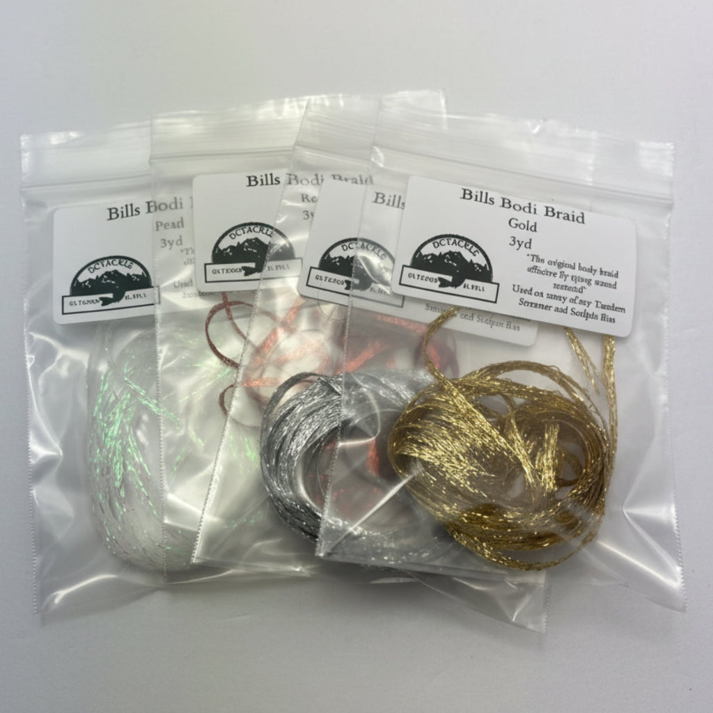 Packages of braid material for fly tying on a white background