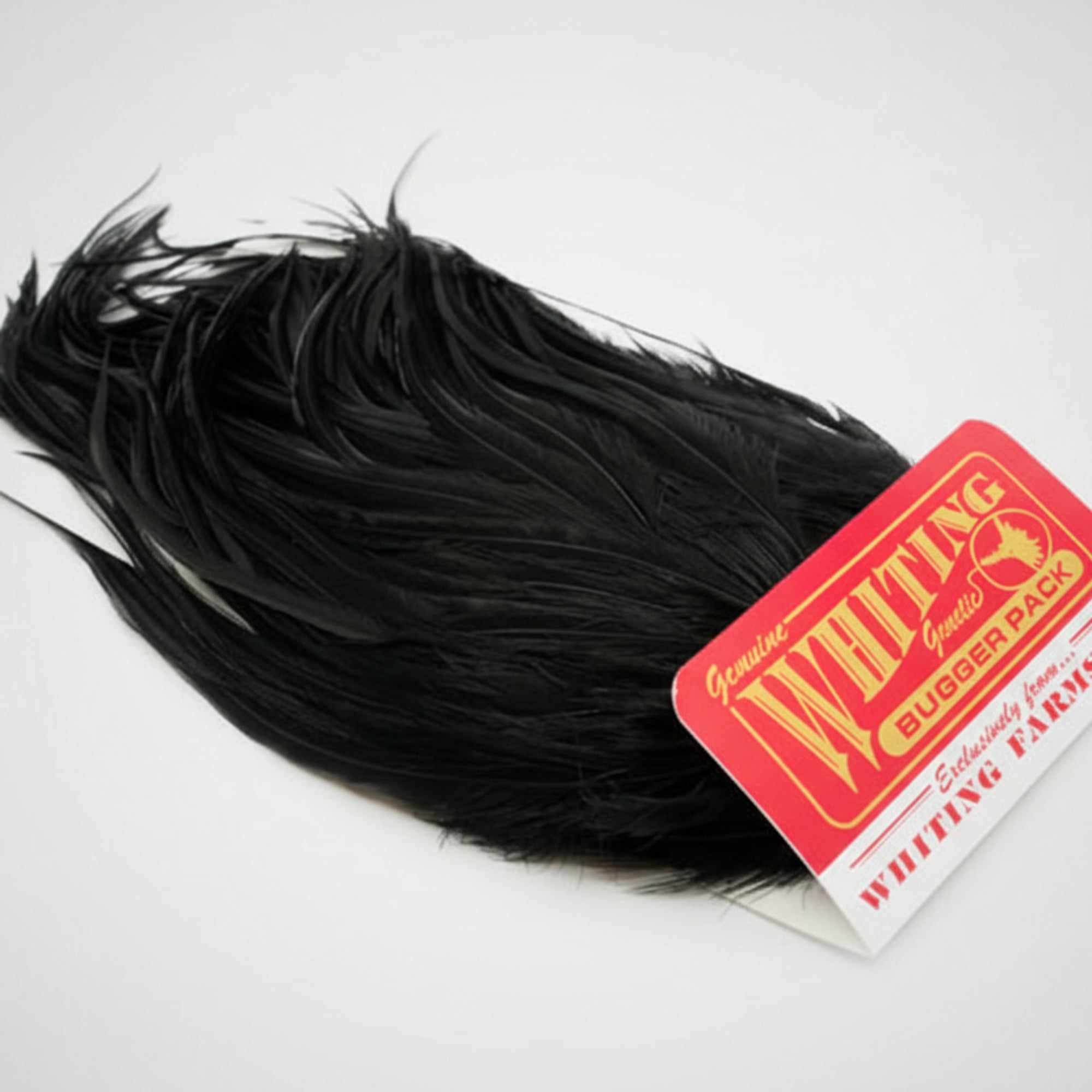 Black feathered product with a red and white label on a white background