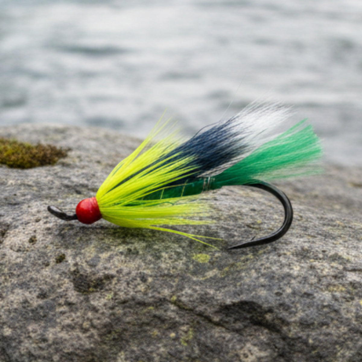 Atalntic salmon fly. Olive body with yellow collar and black and white wing