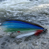 Fishing fly with blue, green, and red feathers on a white background
