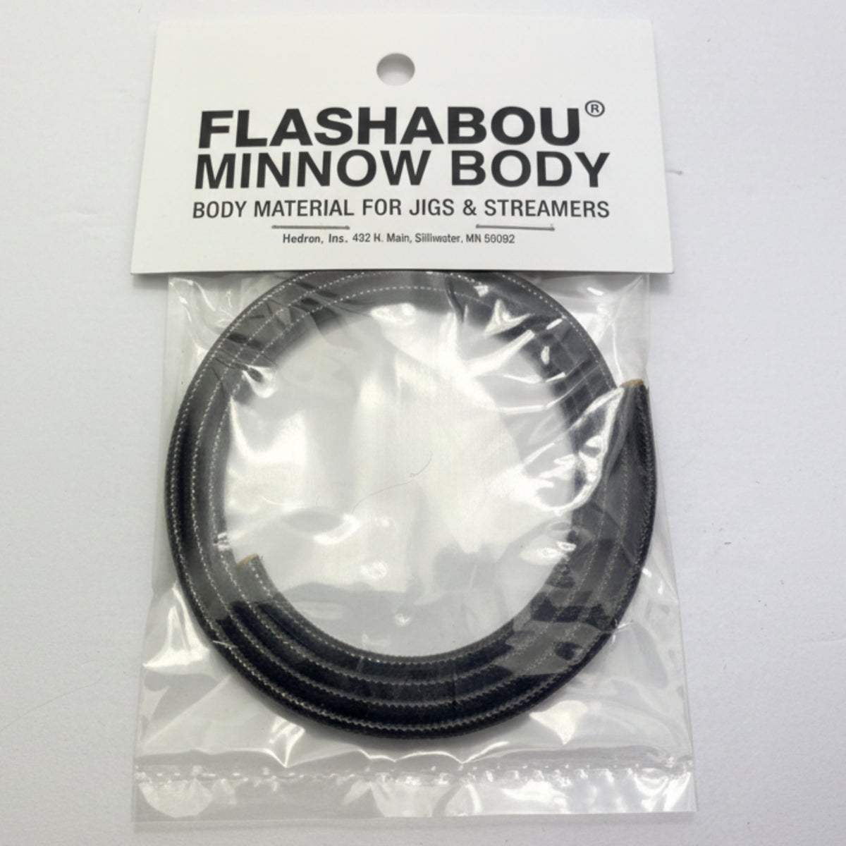 Packaged Flashabou Minnow Body fishing material on a gray background