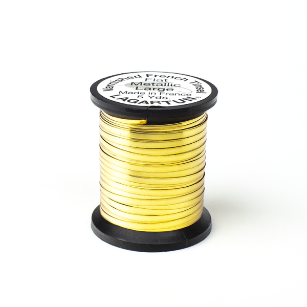 A spool of Lagartun Flat Varnished Tinsel with a metallic gold finish, used for fly tying in fishing.