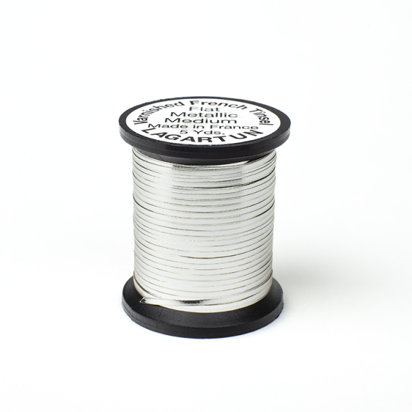 A spool of Lagartun Flat Varnished Tinsel with a metallic gold finish, used for fly tying in fishing.