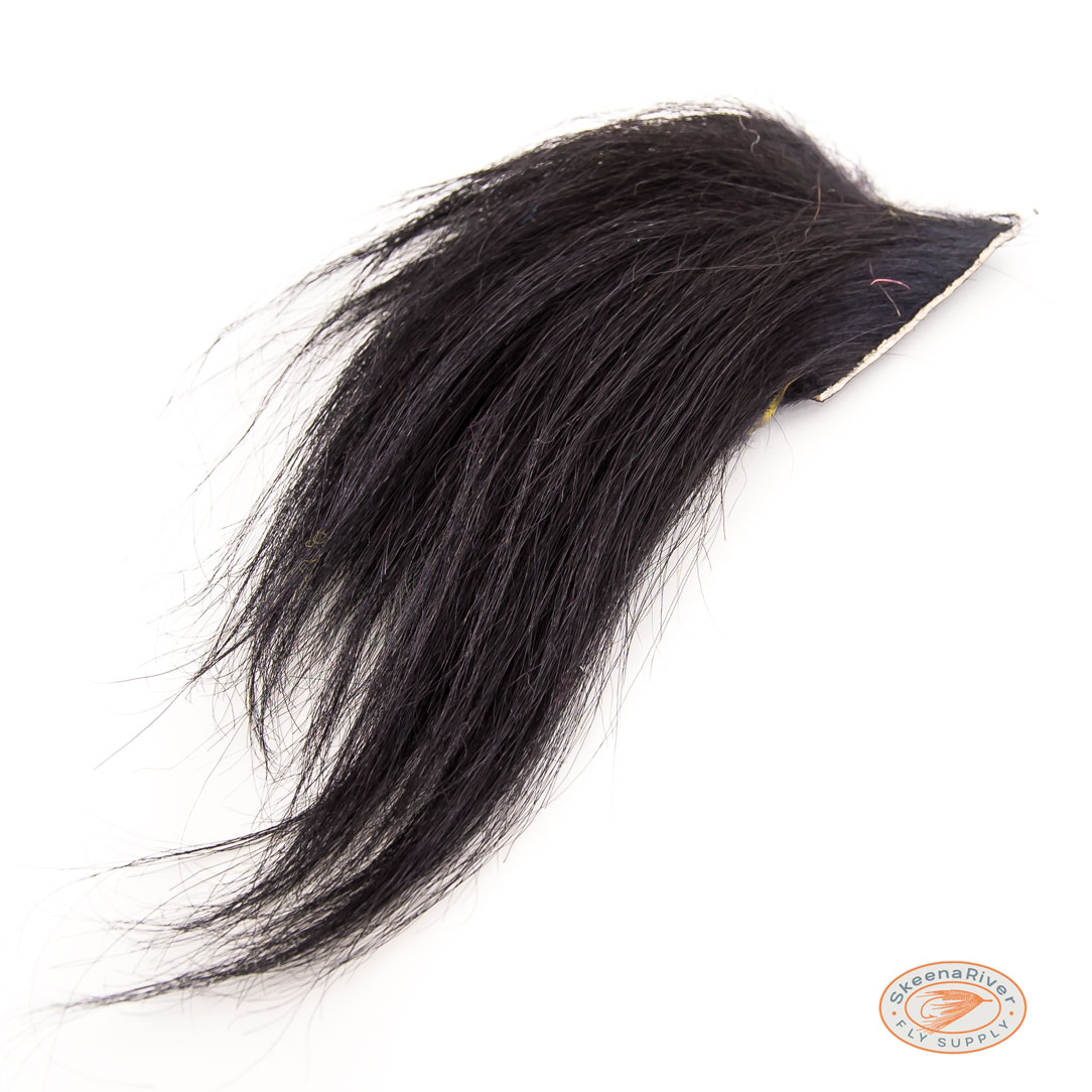 Black Himalayan Mountain Goat fur and hair, used for fly tying materials. The fur is soft and long, with a shiny texture