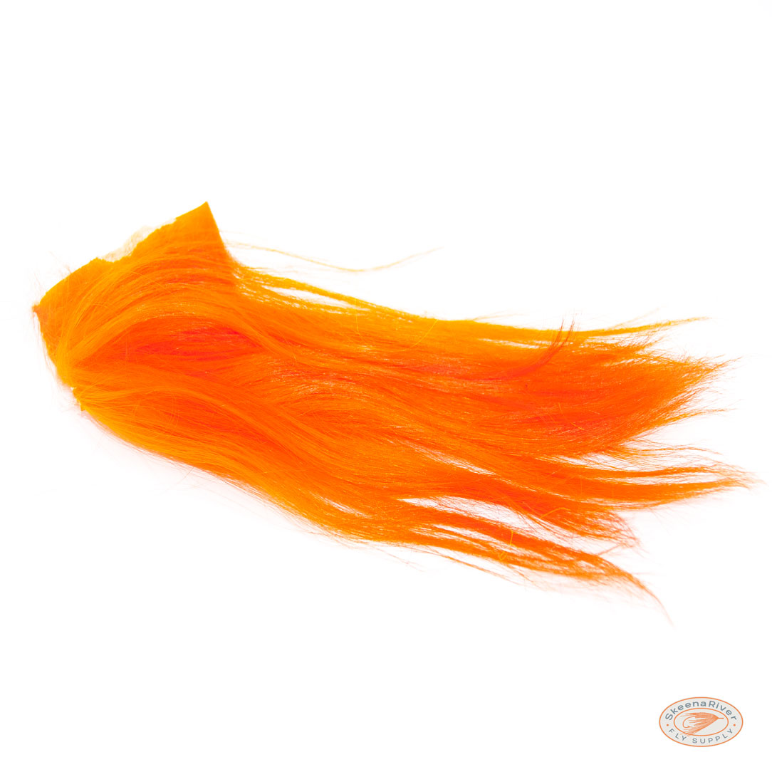 Orange Himalayan Mountain Goat fur and hair, used for fly tying materials. The fur is soft and long, with a shiny texture.