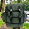 A green Backwoods Mungo Sack backpack with reinforced EVA rubber bottom and padded shoulder straps, displayed outdoors.