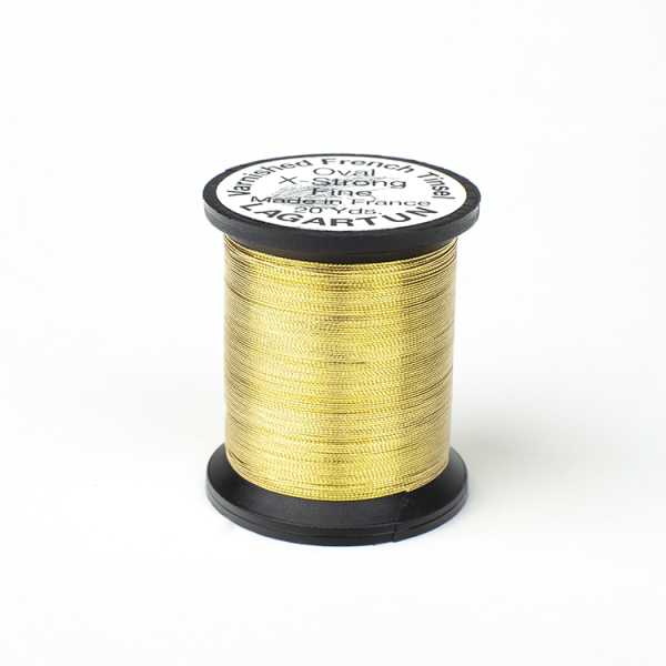 A spool of Lagartun French Varnished Oval Tinsel with a gold-colored metallic finish, used for fly tying in fishing.