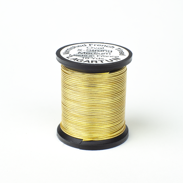 A spool of Lagartun French Varnished Oval Tinsel with a gold-colored metallic finish, used for fly tying in fishing.