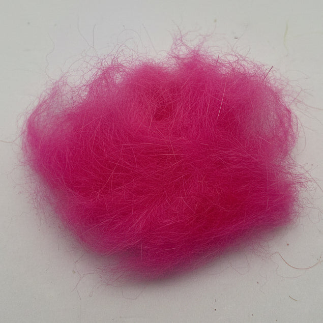Seals fur dubbing in fl. pink on a white background