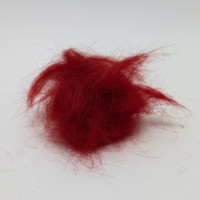 seals fur dubbing in red on a white background