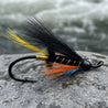atlantic salmon wet fly. thunder and lightning. black body with black wing and orange throat gold ribbing