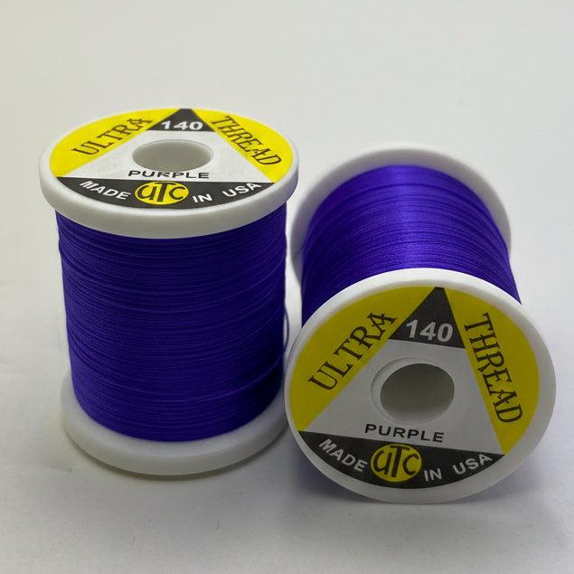 2 Spools of Fly Tying Thread UTC140 Purple on a white background