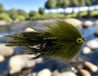 Fishing fly with green and black feathers on a white background