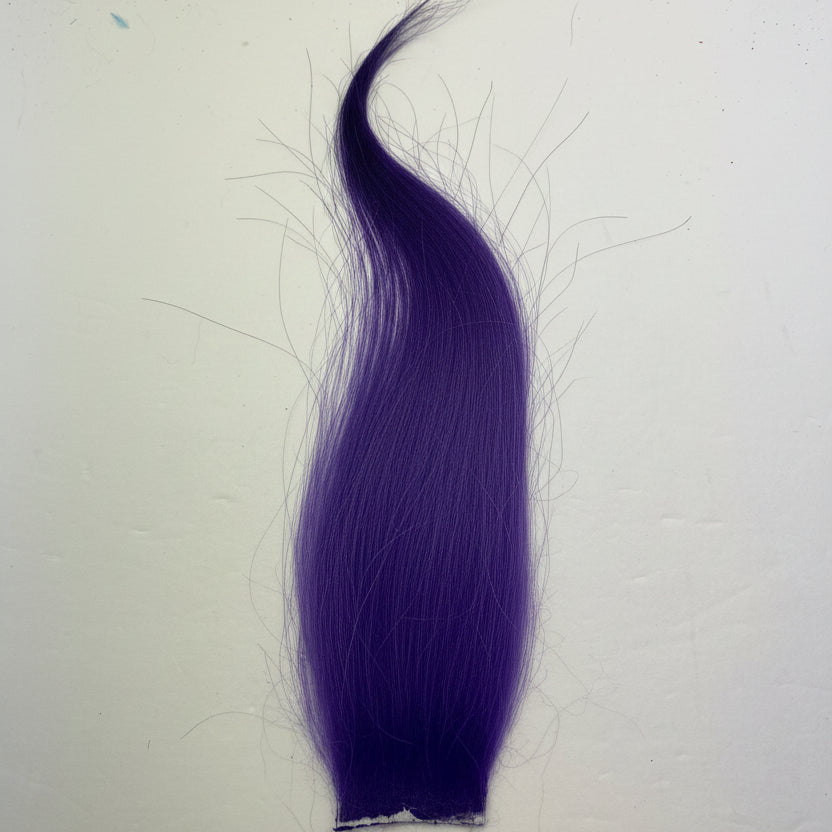 Fly tying material, arctic goat, purple on a white background