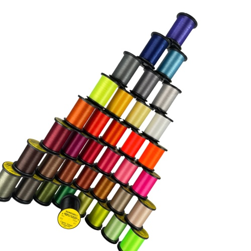 Colorful spools of thread arranged in a pyramid shape on a white background