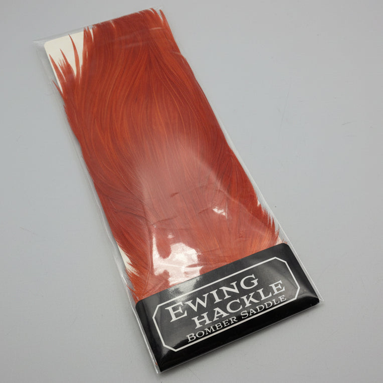 Packaged red feather product with 'Ewing Hackle' label on a white background