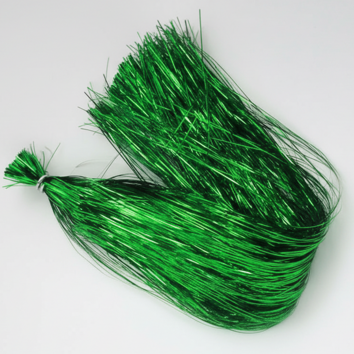 Green tinsel on a white background