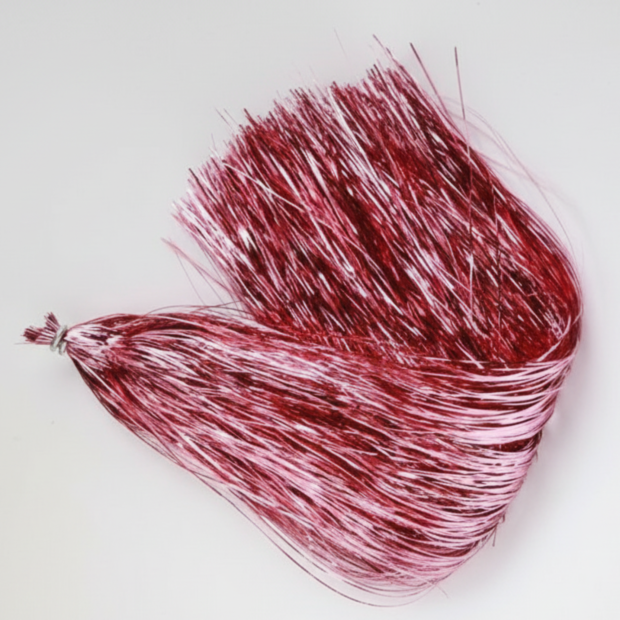 Red and silver tinsel on a white background