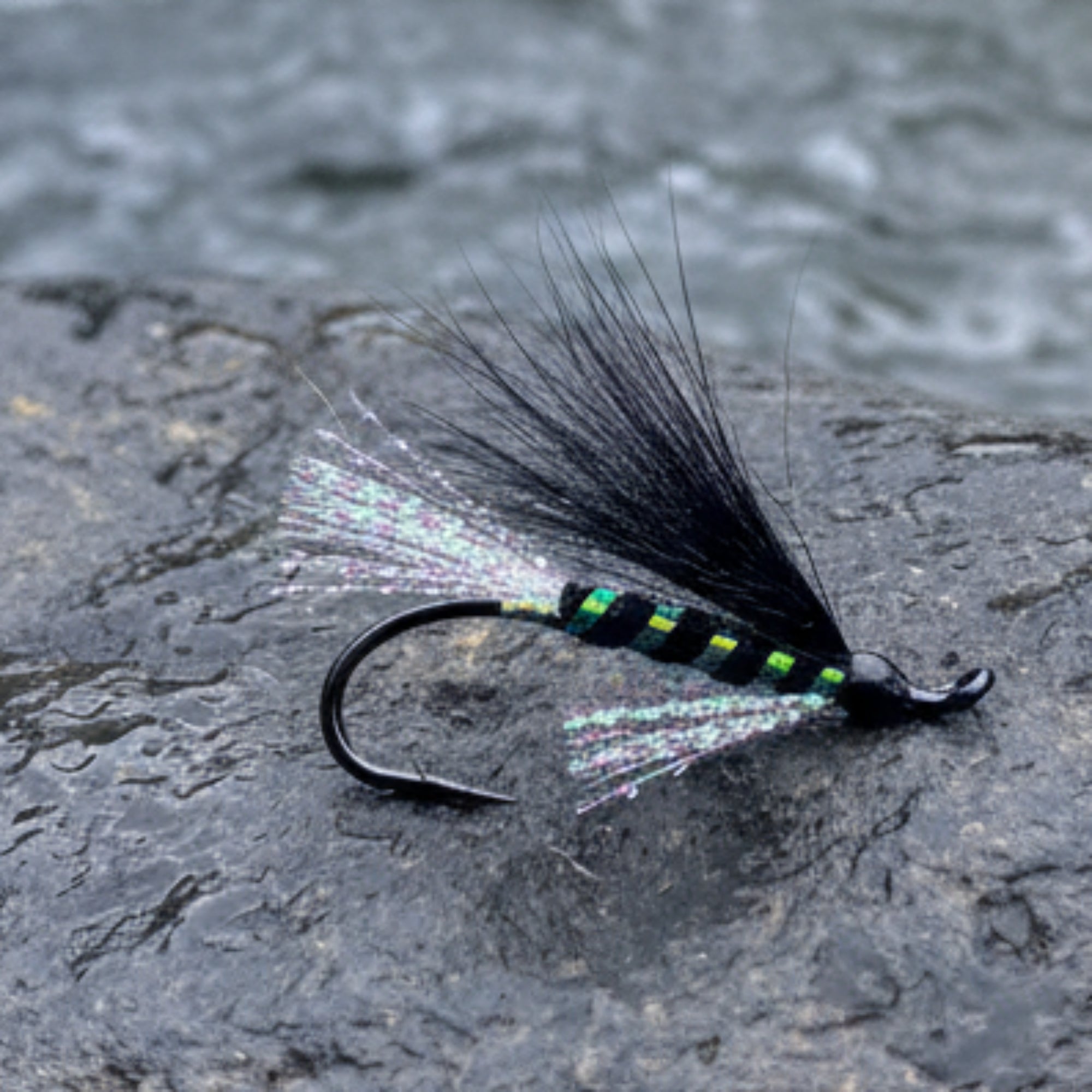 Atalntic salmon fly. Black body and wing with pearl flash