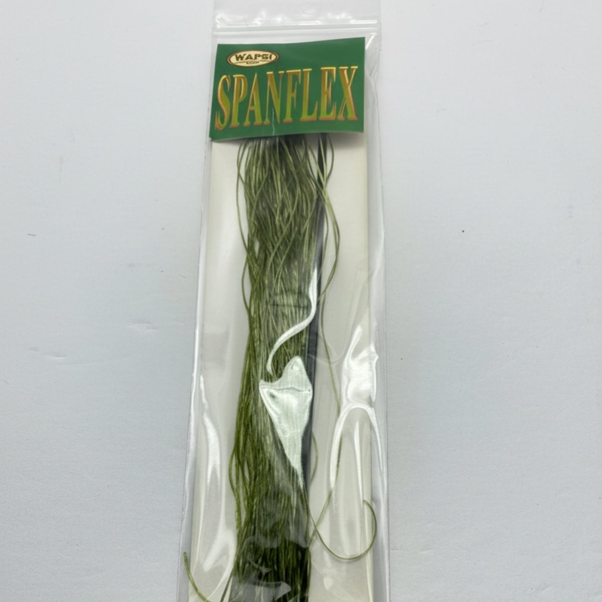 Spandex fibers in packaging with green label on a white background