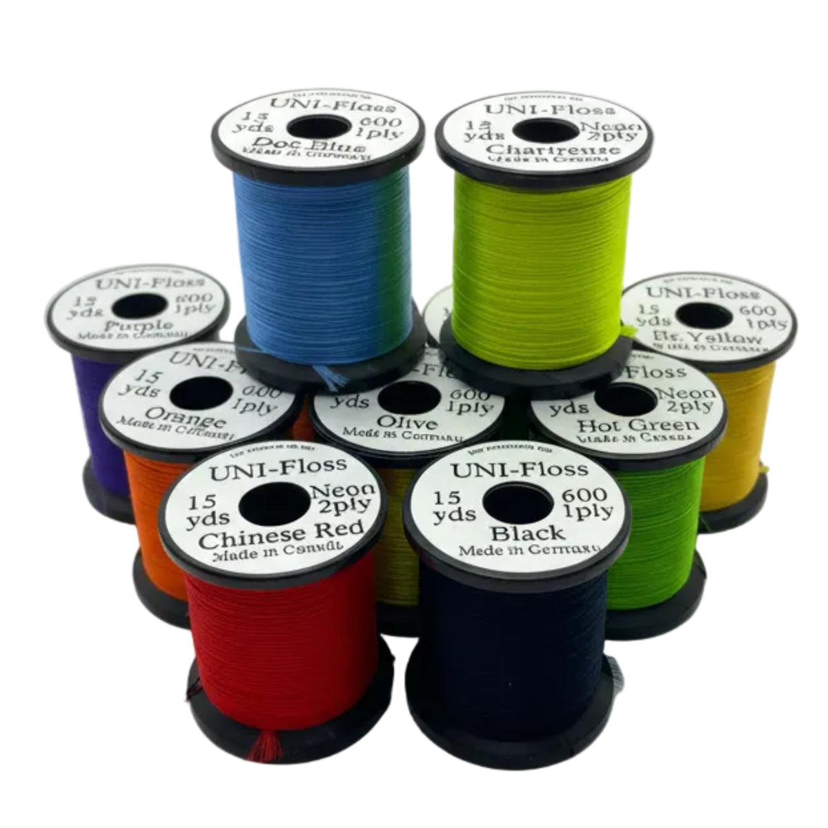 Set of colorful thread spools on a white background
