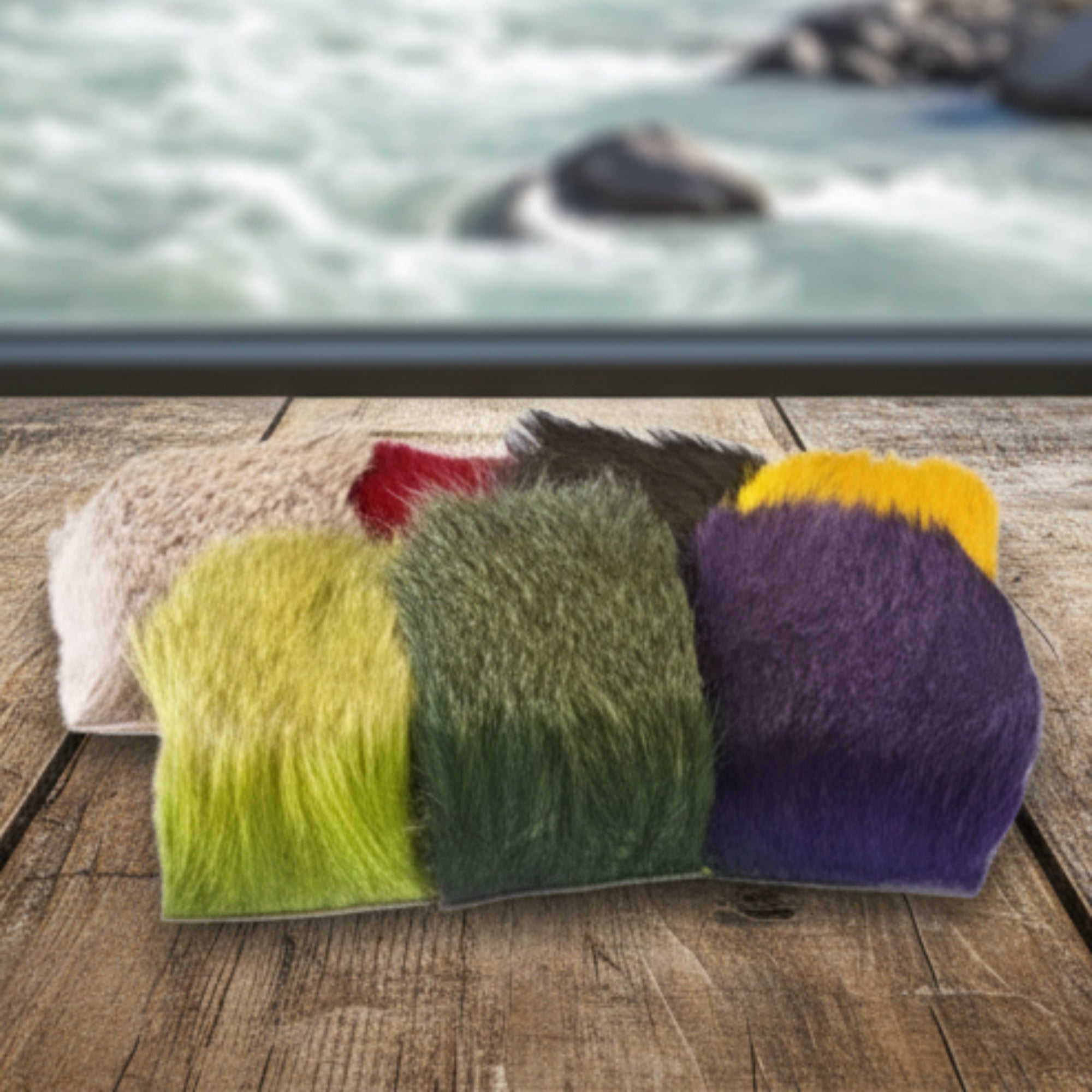 A collection of deer body hair fibers in assorted colors used for fly tying in fishing.