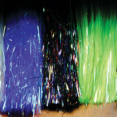 A collection of Flashabou material for fly tying, displaying strands in various colors including blue, black, and green, arranged in a gradient pattern.